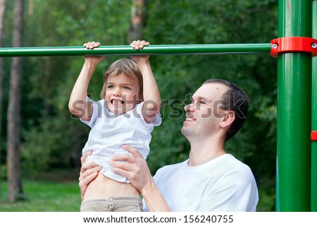 Father and son play sports, outdoor