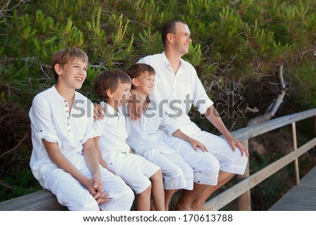 Portrait of father and three sons, outdoor