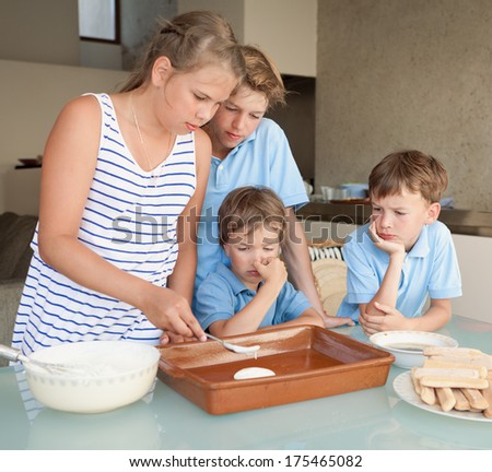 Children make cake in kitchen, indoor