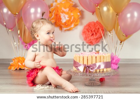 Happy Fancy Beautiful cute baby girl celebrates birthday one year.