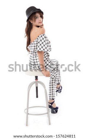 Beautiful young Asian woman full body posing in off shoulder plaid dress isolated on white background.