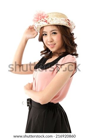 Asian woman  posing in  black collar chiffon top and scallop edge skirt shorts with flower top hat isolated on white background.