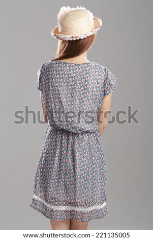 Asian woman posing in 1/2 Sleeve wrapped waist dress with adorable bow print.