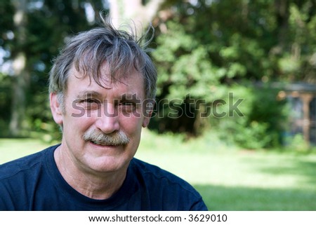 friendly man in his fifties with graying hair