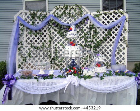stock photo Several tier white wedding cake with purple accents