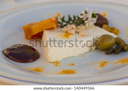 Sheep cheese with herbs, fruits and nut