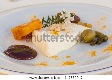 Sheep cheese with herbs, fruits and nut