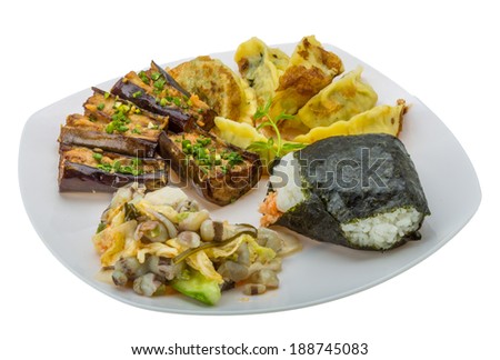 Japan traditional food - rice ball, gyoza, eggplant and octopus salad
