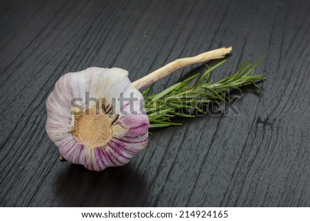 Garlic with rosemary on the desk