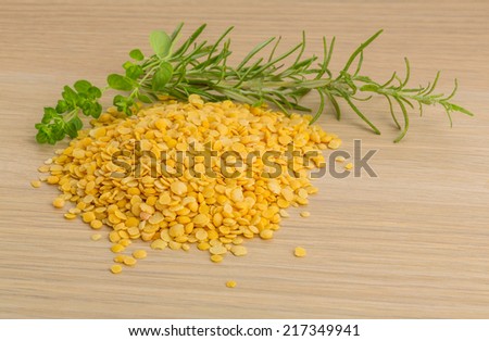 Raw yellow lentils with herbs