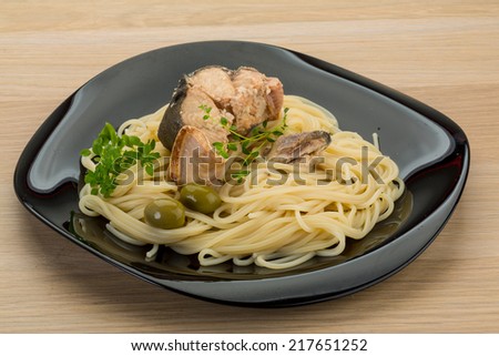 Pasta spaghetti with salmon and herbs on board