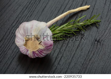 Garlic with rosemary on the desk