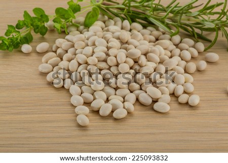 Raw white beans on the board