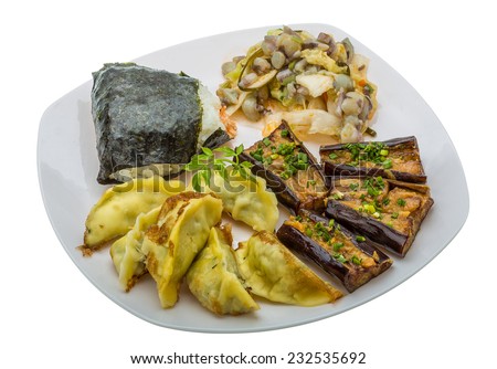 Japan traditional food - rice ball, gyoza, eggplant and octopus salad