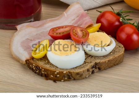 Breakfast with Bacon sandwich on the wood background