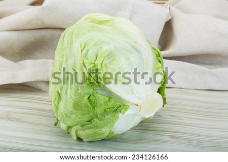 iceberg salad - on the wooden background
