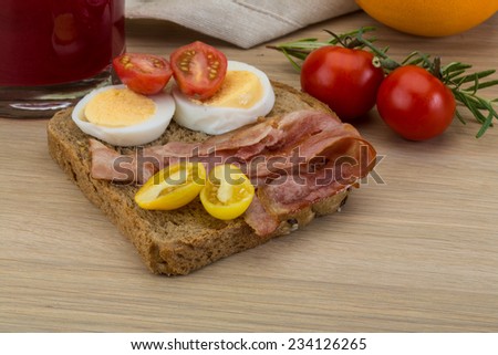 Breakfast with Bacon sandwich on the wood background