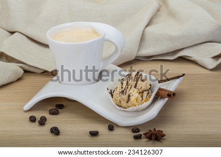 Coffee with cake served beans and cinnamon
