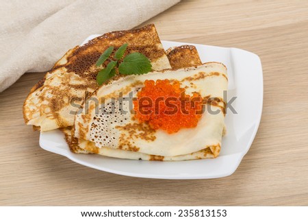 Pancakes with red caviar - famous Russian food