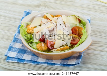 Caesar salad with chicken and iceberg salad