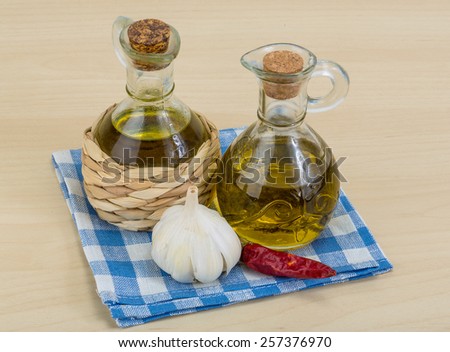 Olive oil bottles with garlik and pepper