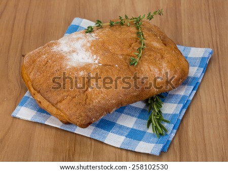Famous Italian bread Ciabatta with thyme and rosemary