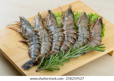 Raw tiger shrimps on the wood board