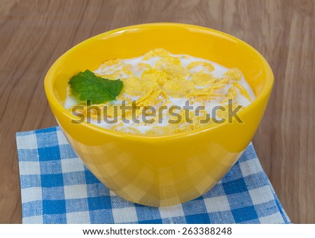 Morning food - cornflakes with milk on the napkin