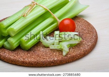Fresh Green Celery sticks on the wood background