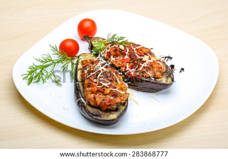 Eggplant stuffed minced meat with tomato, cheese and herbs