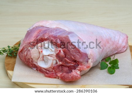 Raw turkey leg with thyme - ready for cooking