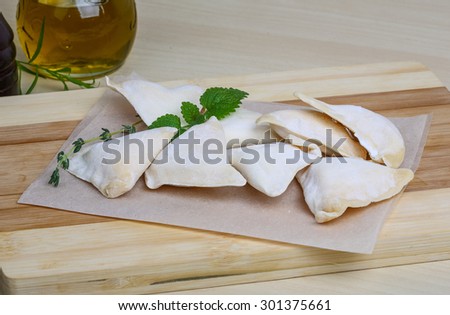Raw potato dumplings - Ukrainian Vareniki served dill branch