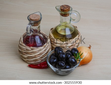 Olive oil and vinegar bottles served berries