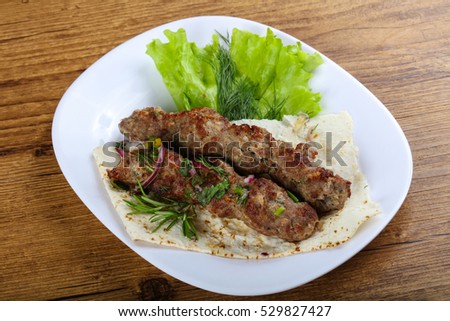 Lamb kebab with onion and rosemary