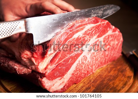 cut of raw best quality ox meet close up in a wood