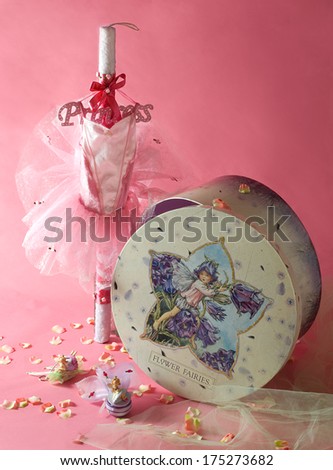 baptism candle, bonbonniere and box decorated by fairy for girl on pink background