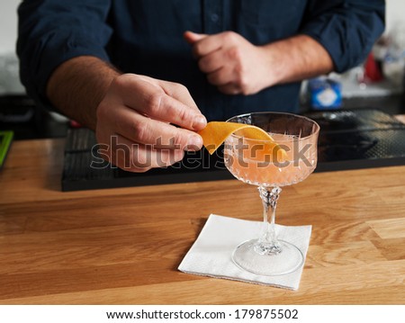 bartender making cocktails and serves