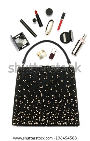 compositions ladies bag black color and various cosmetic isolated on white background