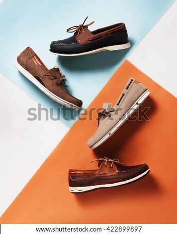 deck summer shoes in pan with a colorful  symmetric background with pastel colors