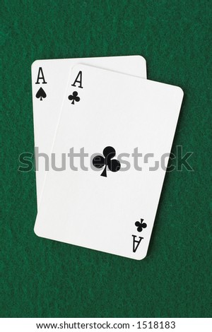Ace of spades and clubs on a green background
