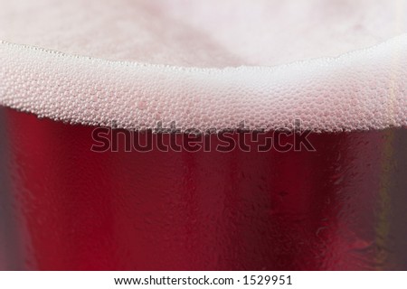 Close up shot of a glass of cherry fruit beer