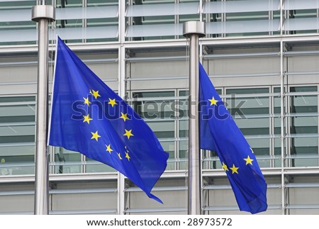 European flags floating in front of the European Commission Building in Brussels
