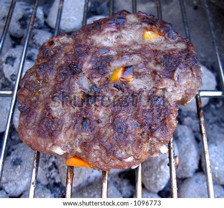 Barbeque with home-made burger cooking. Great \'Summer is coming\' image.