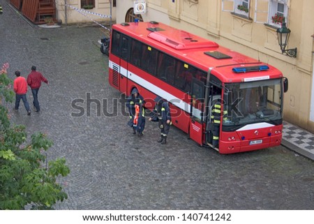 PRAGUE, CZECH REPUBLIC - JUNE 2: Fire brigade setting up bus to serve as head quarters in the flooded Malastrana district, Prague, on June 2, 2013 in Prague, Czech Republic