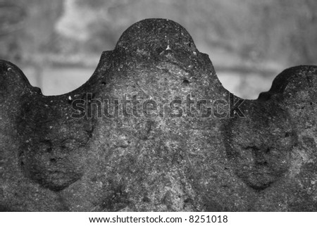 black and white image of a grave stone with the word \