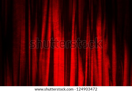 red theater curtain with soft lighting