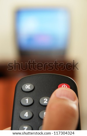 Television screen with tv remote control  in foreground.....
