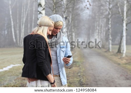 beautiful romantic couple outside in warm clothing
