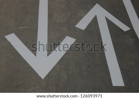 fresh arrows on a asphalt surface outside