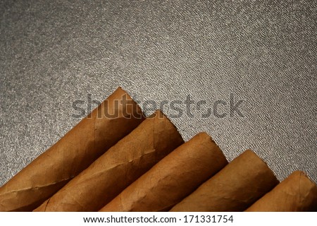cigars in dramatic lighting.